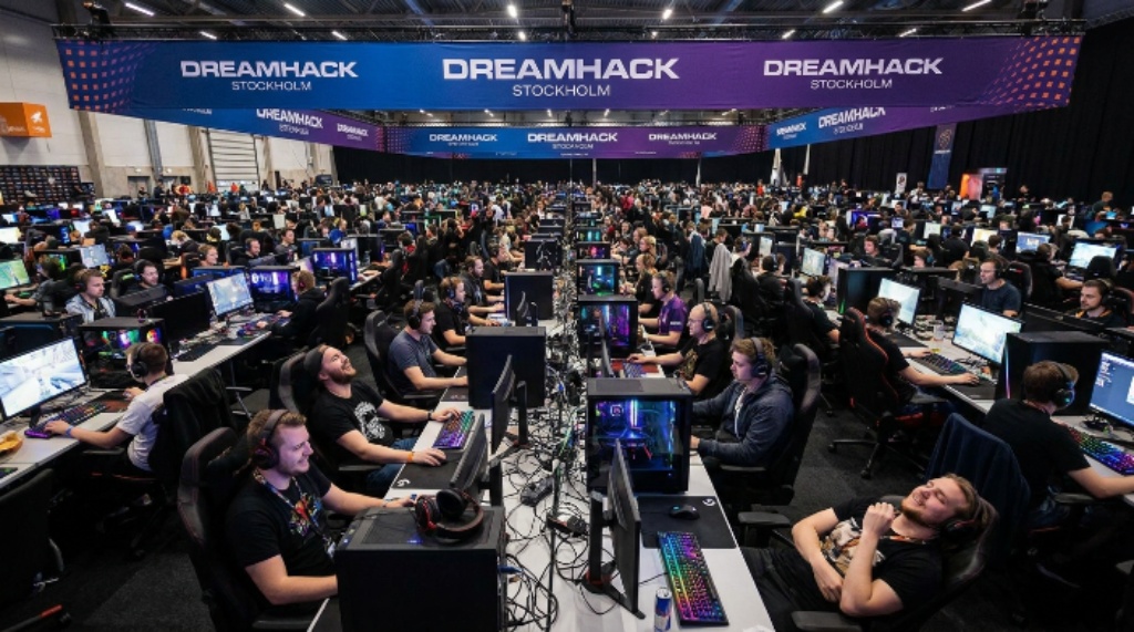 Crowded LAN hall at DreamHack Stockholm with glowing gaming setups