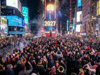 Crowds gather in Times Square watching the illuminated ball drop on New Year's Eve to welcome 2027